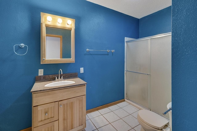 full bathroom with vanity, toilet, a shower with shower door, and tile patterned floors