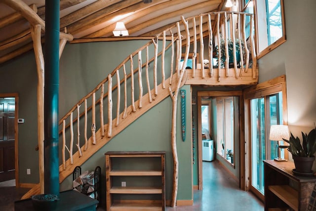 5664 N Dutch Hollow Rd, Potosi, WI 53820 - stairs with concrete floors and a towering ceiling