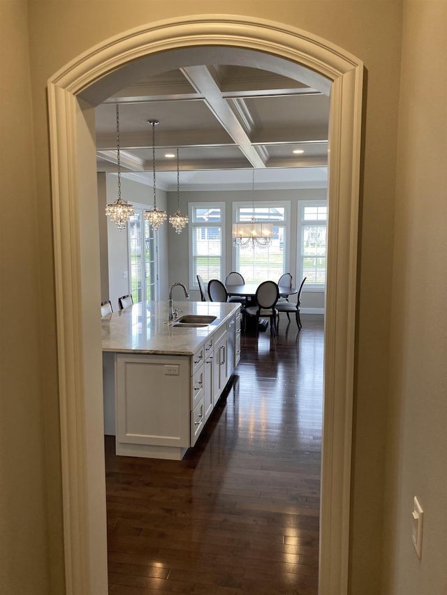 4922 Saint Annes Dr, Waunakee, WI 53597 - kitchen with an inviting chandelier, a sink, coffered ceiling, and white cabinetry