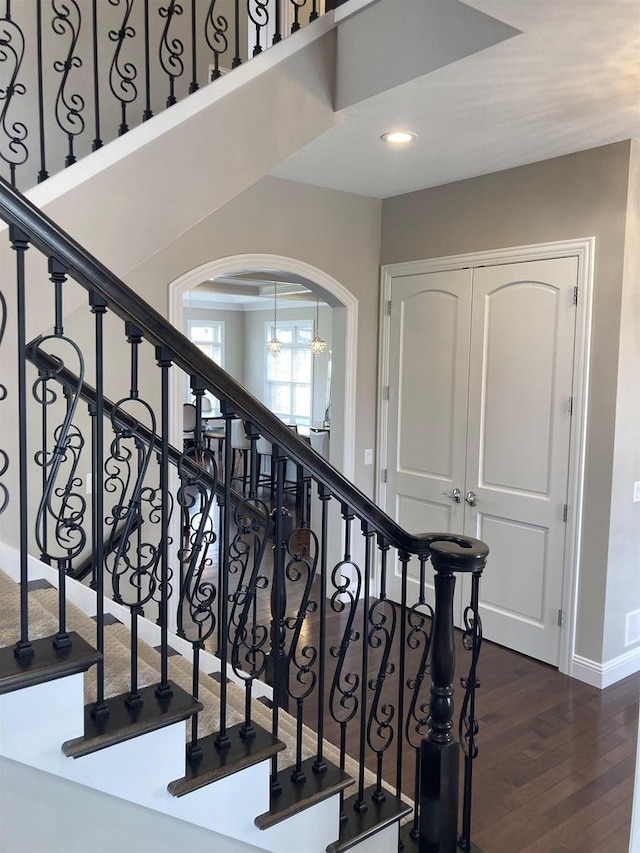 4922 Saint Annes Dr, Waunakee, WI 53597 - stairway featuring arched walkways, baseboards, recessed lighting, and wood finished floors
