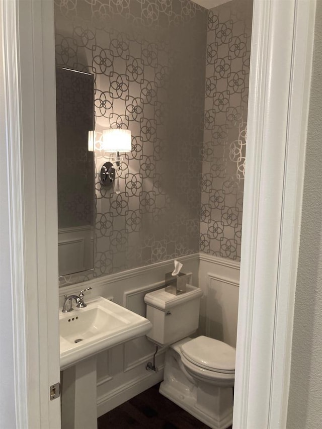 4922 Saint Annes Dr, Waunakee, WI 53597 - bathroom with wainscoting, wallpapered walls, and toilet