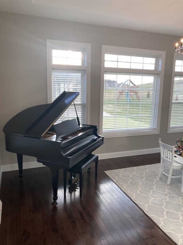 4922 Saint Annes Dr, Waunakee, WI 53597 - sitting room featuring baseboards, dark wood finished floors, and an inviting chandelier
