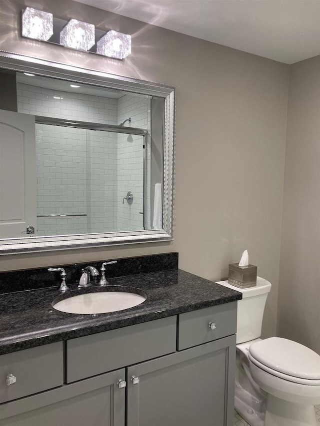 4922 Saint Annes Dr, Waunakee, WI 53597 - bathroom featuring vanity, a stall shower, and toilet