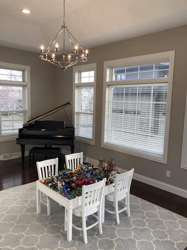 4922 Saint Annes Dr, Waunakee, WI 53597 - dining space with baseboards, an inviting chandelier, and wood finished floors