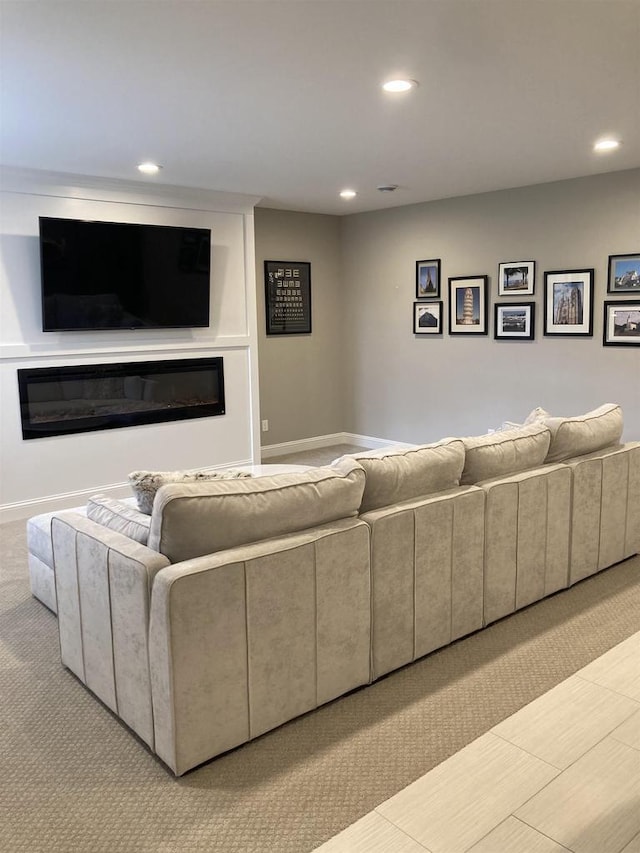 4922 Saint Annes Dr, Waunakee, WI 53597 - living room featuring recessed lighting, carpet, baseboards, and a glass covered fireplace