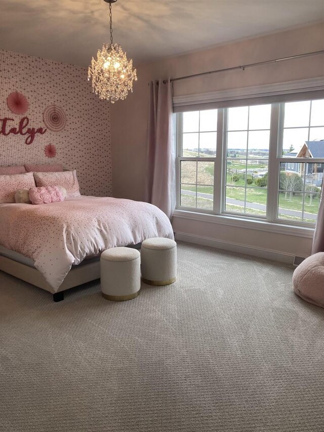 4922 Saint Annes Dr, Waunakee, WI 53597 - carpeted bedroom with baseboards and a chandelier