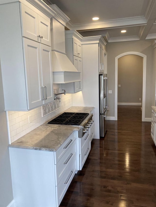4922 Saint Annes Dr, Waunakee, WI 53597 - kitchen featuring crown molding, light stone counters, high end fridge, white cabinetry, and custom range hood