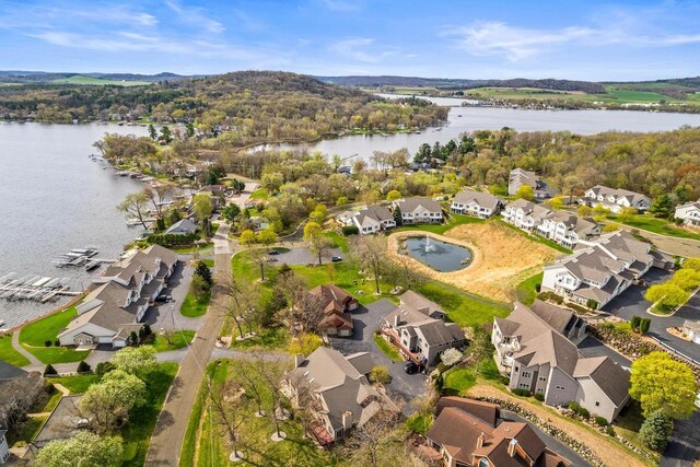 aerial view featuring a residential view and a water view
