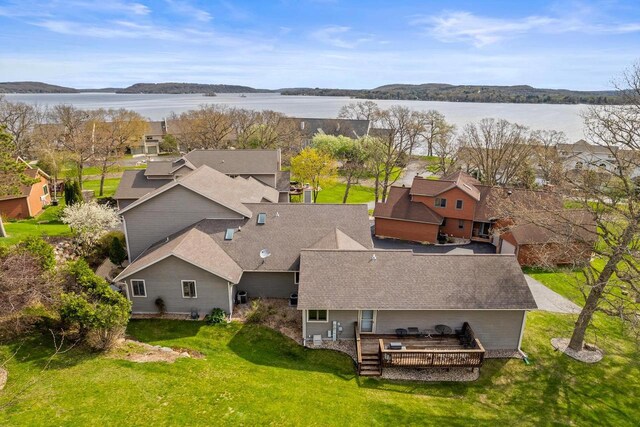 birds eye view of property featuring a water view and a residential view
