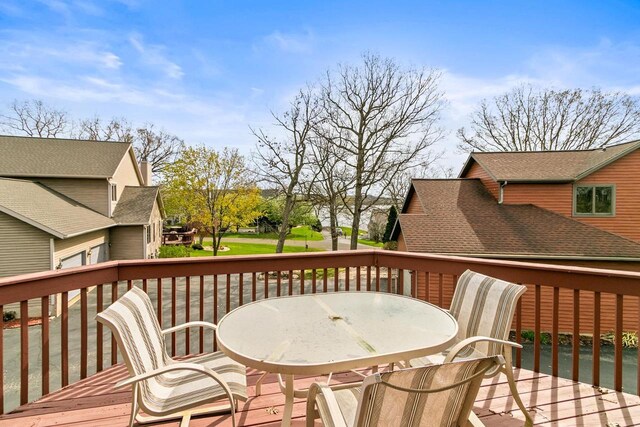 wooden terrace featuring outdoor dining area