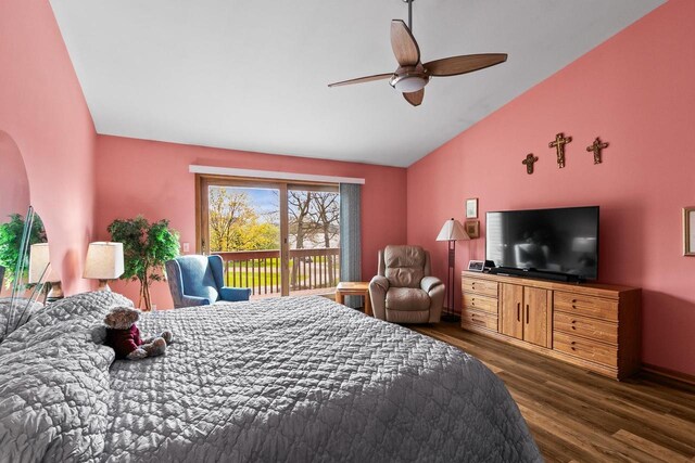 bedroom with a ceiling fan, wood finished floors, access to exterior, arched walkways, and vaulted ceiling