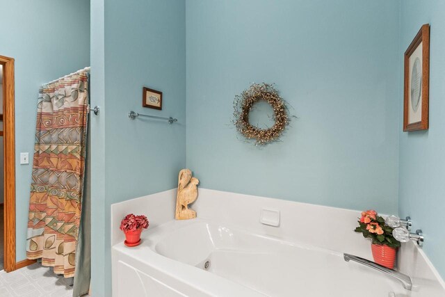 bathroom with a garden tub