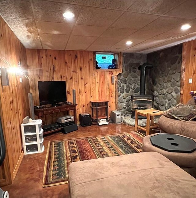 13541 W Whispering Pine Trl, Hayward, WI 54843 - living area with a wood stove, wooden walls, and recessed lighting
