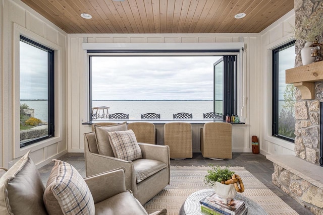 9458 Warner Rd, Winneconne, WI 54986 - living room featuring wooden ceiling, healthy amount of natural light, and a water view