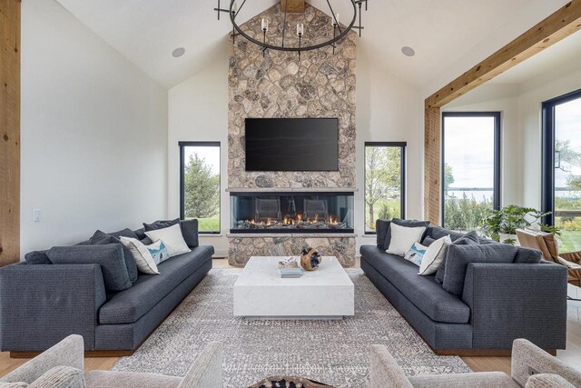 9458 Warner Rd, Winneconne, WI 54986 - living area with lofted ceiling, wood finished floors, and a stone fireplace