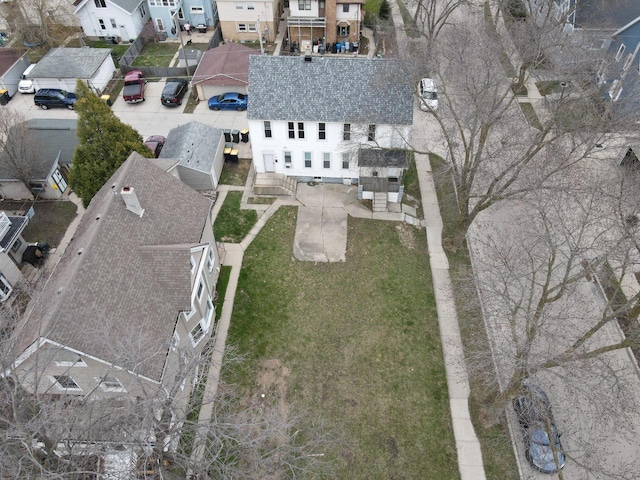 birds eye view of property with a residential view