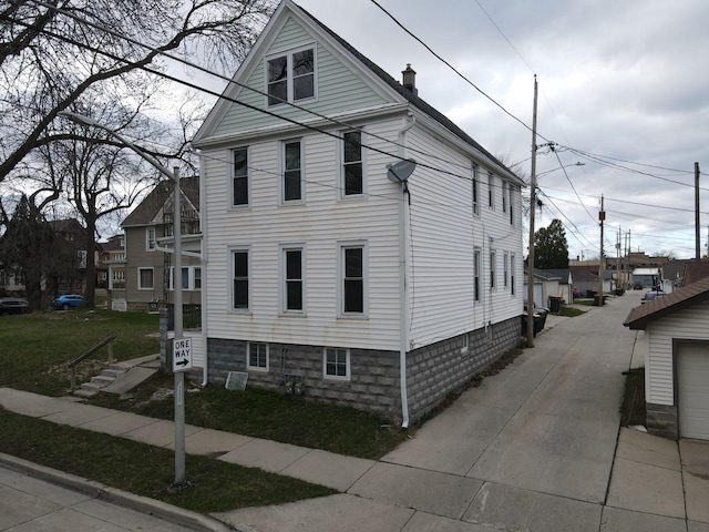 view of home's exterior with a chimney