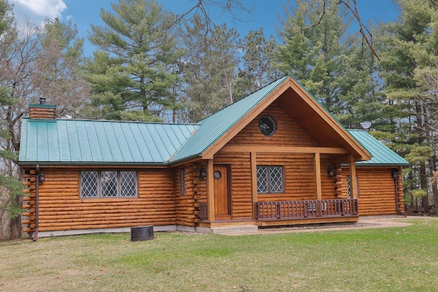 N7589 Lakeside Dr, Portage, WI 53901 - cabin featuring a standing seam roof, log siding, and metal roof