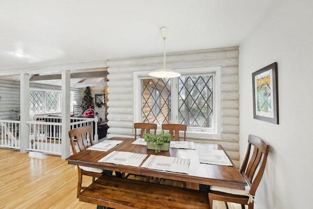 N7589 Lakeside Dr, Portage, WI 53901 - dining room with log walls and wood finished floors
