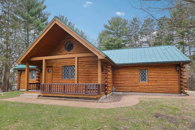 N7589 Lakeside Dr, Portage, WI 53901 - log home with metal roof, a standing seam roof, and log siding