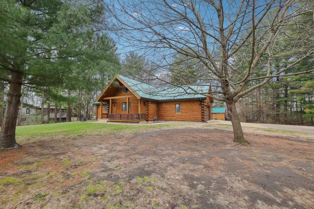 N7589 Lakeside Dr, Portage, WI 53901 - exterior space with log siding and covered porch
