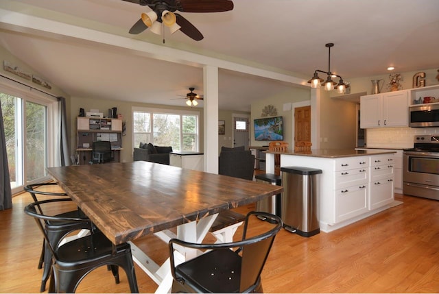dining area with light wood-style floors, vaulted ceiling, a ceiling fan, and recessed lighting