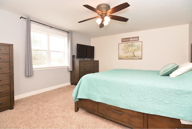bedroom featuring carpet flooring, baseboards, and ceiling fan