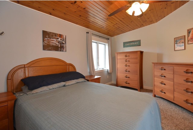 carpeted bedroom with baseboards, a ceiling fan, and wooden ceiling