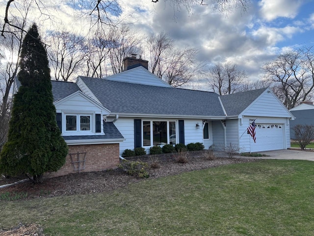 view of front of property with a front lawn, a garage, a shingled roof, a chimney, and concrete driveway