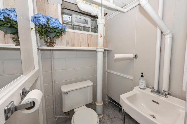half bath with toilet and a sink