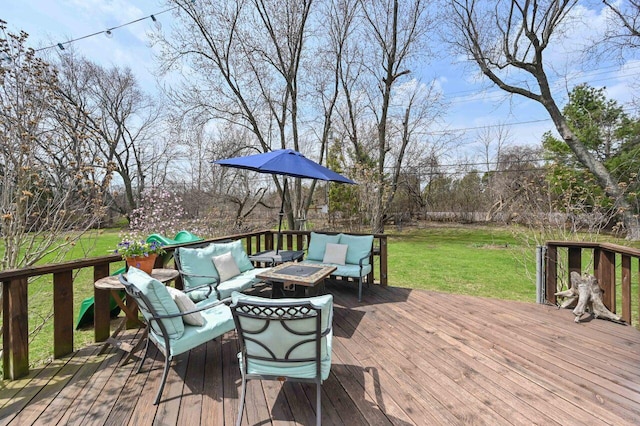 wooden deck with an outdoor living space and a yard