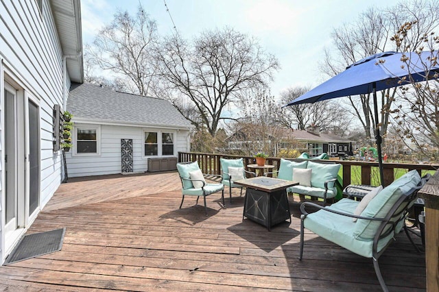 wooden deck featuring outdoor lounge area