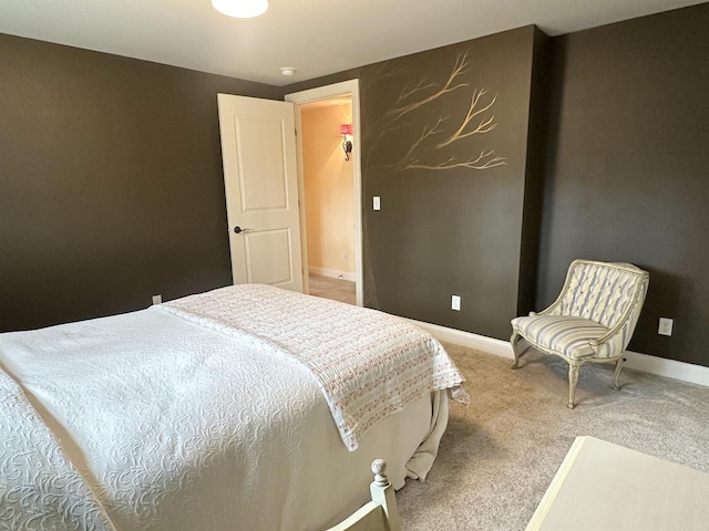 bedroom with baseboards and carpet flooring