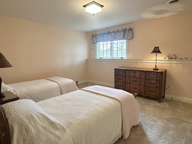 carpeted bedroom with baseboards