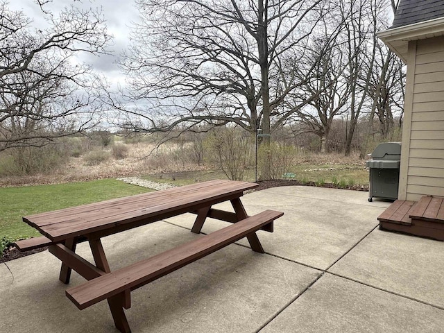 view of patio with outdoor dining space and area for grilling