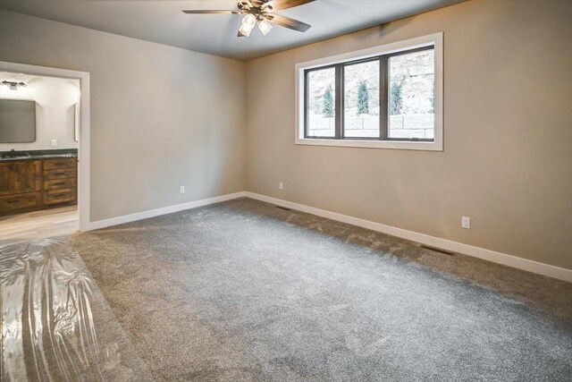 4021 Red Hawk Run, Black Earth, WI 53515 - empty room with carpet flooring, a ceiling fan, and baseboards