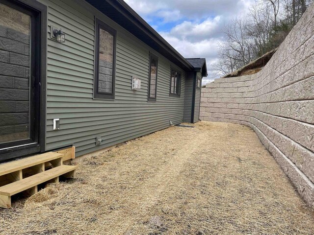 4021 Red Hawk Run, Black Earth, WI 53515 - view of side of home with entry steps and fence