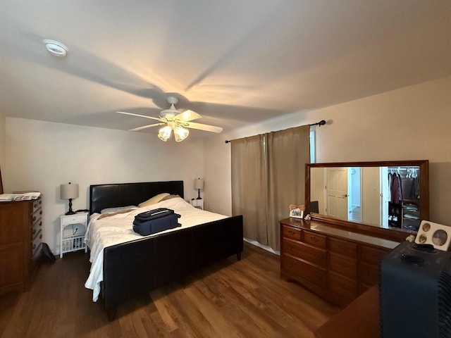 bedroom featuring wood finished floors and a ceiling fan