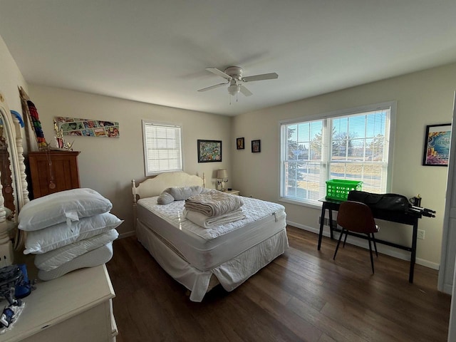 bedroom featuring dark wood-type flooring, ceiling fan, and baseboards
