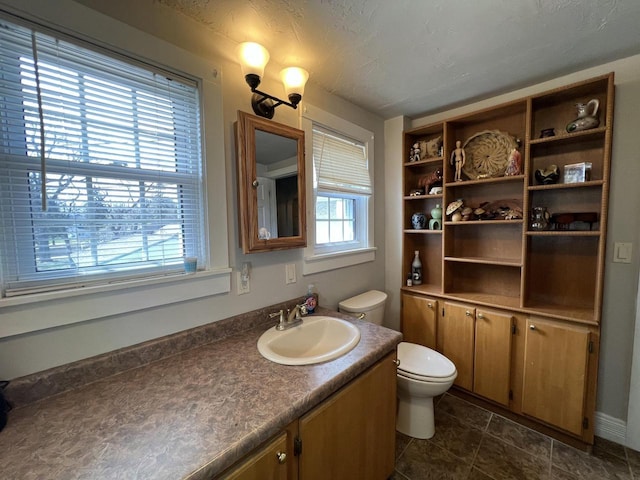201 Bonito St, Walworth, WI 53184 - bathroom with tile patterned floors, vanity, and toilet