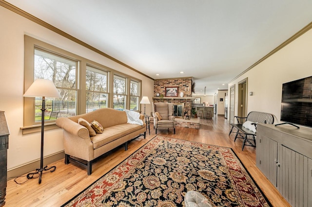 living room with crown molding, baseboards, recessed lighting, a brick fireplace, and wood finished floors