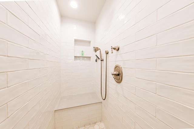 full bathroom with a tile shower