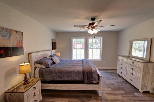 10230 Olker Rd, Hayward, WI 54843 - bedroom featuring baseboards, dark wood-style floors, and ceiling fan