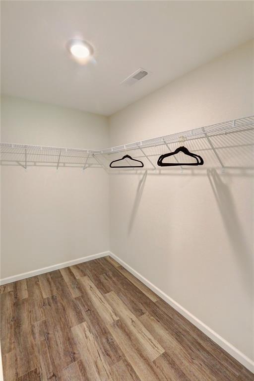 10230 Olker Rd, Hayward, WI 54843 - walk in closet with wood finished floors and visible vents