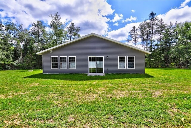 10230 Olker Rd, Hayward, WI 54843 - rear view of property with a lawn