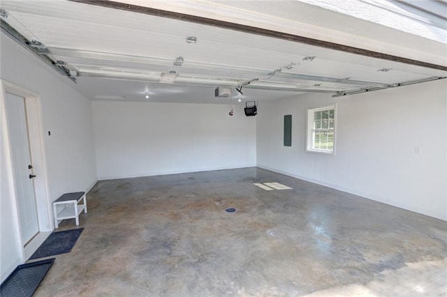 10230 Olker Rd, Hayward, WI 54843 - garage featuring electric panel and a garage door opener