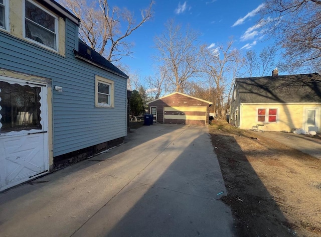 1921 S Wisconsin Ave, Beloit, WI 53511 - view of property exterior featuring a detached garage and an outdoor structure