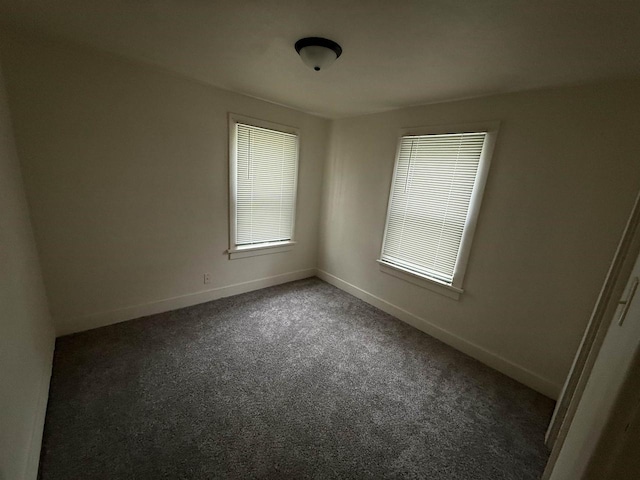 1921 S Wisconsin Ave, Beloit, WI 53511 - carpeted empty room with baseboards