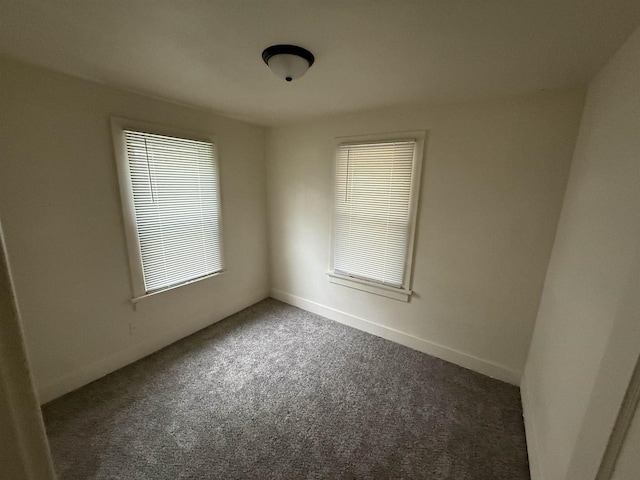 1921 S Wisconsin Ave, Beloit, WI 53511 - carpeted empty room featuring baseboards