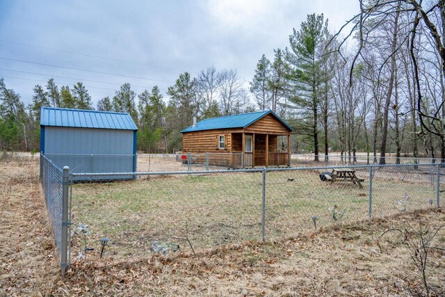 W4742 26th St, Necedah, WI 54646 - view of yard featuring an outdoor structure and fence